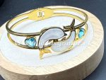 Pulsera delfín nacar ,acero 316 L chapado oro 18k